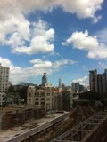 Fototapeta Miasta - Cloudy Sky And Construction Of City In Asia