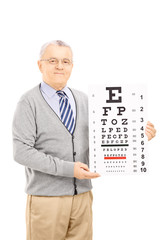 Wall Mural - Senior man holding eyesight test