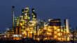 Illuminated oil and gas refinery plant at night