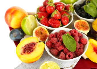 Wall Mural - Assortment of juicy fruits and berries, isolated on white