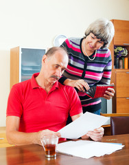 senior family  with financial documents