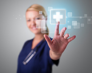 Young nurse pressing modern medical type of buttons