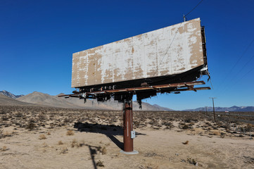 old rusted blank billboard by road