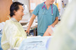 © Tyler Olson - Doctor Giving Good News to Birthing Mother