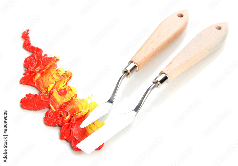 Painting palette knifes with paint isolated on white