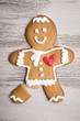 Gingerbread man with red heart and broken leg