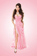 Beauty fashionable woman in elegant pink dress isolated over pin