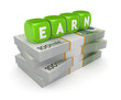 © rukanoga - Word EARN on stack of dollars.