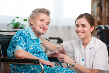 senior woman with her home caregiver