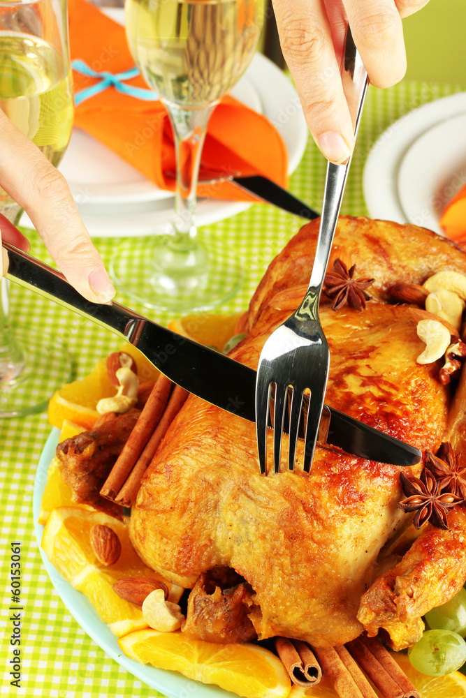 Cutting baked chicken close-up. Thanksgiving Day