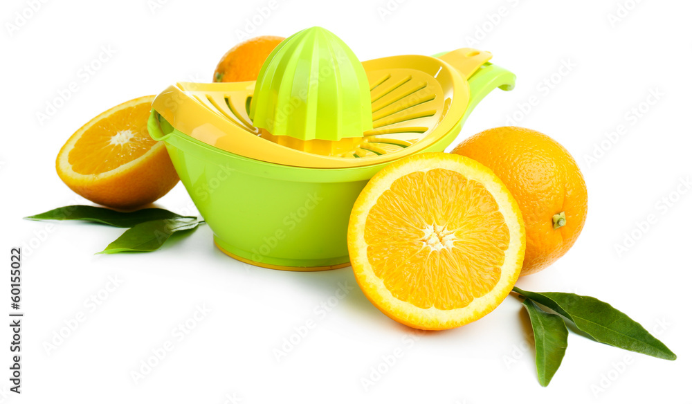 Citrus press and oranges isolated on white