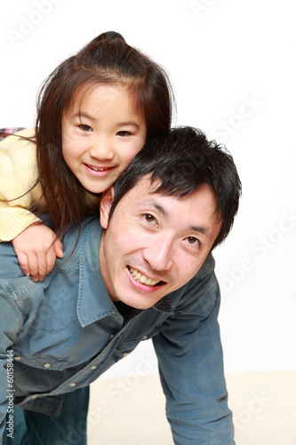 お馬さんごっこをする日本人のパパと娘 Stock Photo Adobe Stock お馬さんごっこをする日本人のパパと娘 Stock Photo Adobe Stock