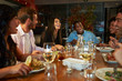 © Monkey Business - Group Of Friends Enjoying Meal In Restaurant