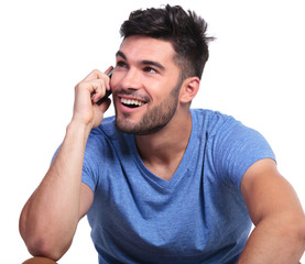 casual man talking on phone and looks up