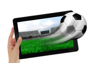 Wall Mural - Hand holding tablet with soccer ball flying off screen