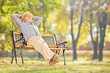 © Ljupco Smokovski - Senior gentleman sitting on a bench and relaxing in a park