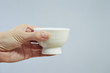 © mnimage - Woman holding cup