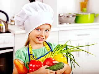 Child cooking at kitchen.