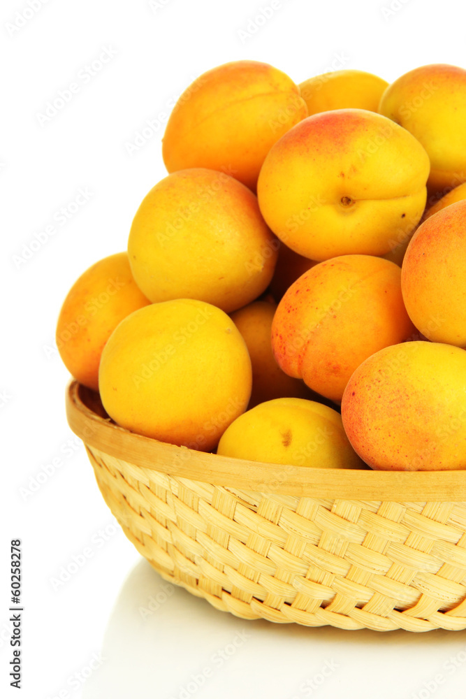 Fresh natural apricot in wicker basket isolated on white