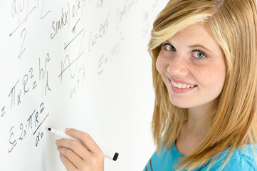 Student teenage girl write mathematics white board