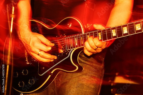 Fototapeta na wymiar Live Concert guitar player close-up
