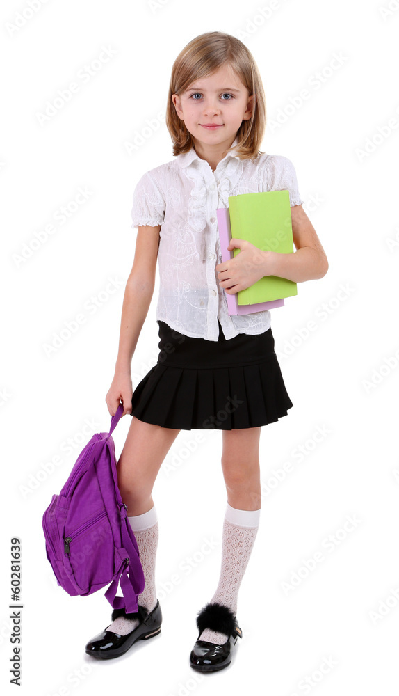 Beautiful little girl with backpack holding books isolated