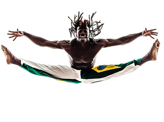 brazilian  black man dancer dancing capoeira  silhouette