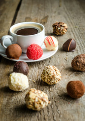 Wall Mural - Luxury chocolate candies and cup of coffee