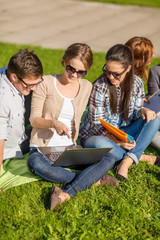 Canvas Print - students or teenagers with laptop computers