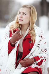 Wall Mural - beautiful blonde in a traditional Russian scarf winter snow