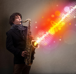 young man playing on saxophone with colorful sound waves