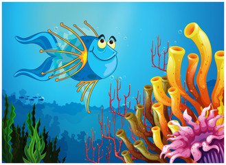 Poster - A blue fish under the sea near the coral reefs