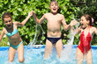 © Pavel Losevsky - Three happy kids having fun in swimming pool