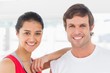 © WavebreakmediaMicro - Close-up of a fit smiling couple in exercise room