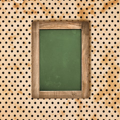 Wall Mural - antique green chalkboard over vintage polka dot background