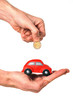 man inserting coin into mini car piggy bank