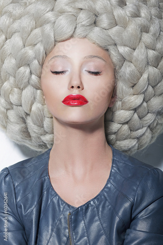 Naklejka na kafelki Fantasy. Creativity. Trendy Woman in Futuristic Wig with Braids