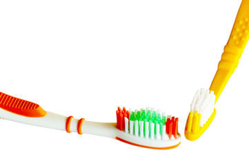 Closeup Detail Of Isolated Colored Toothbrushes on White