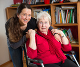 Fototapeta Mapy - female senior in wheelchair with her daughter