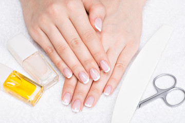 Wall Mural - Woman in a nail salon receiving manicure