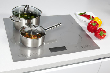 Grey glass induction hob in the kitchen 