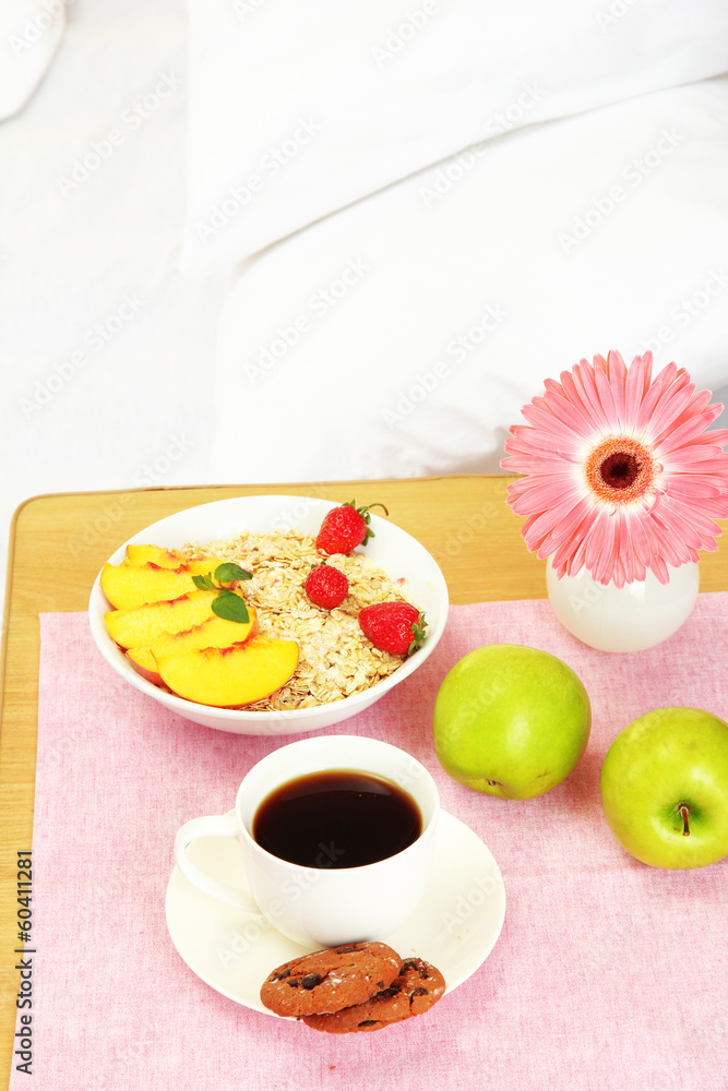 light breakfast on the nightstand next to the bed