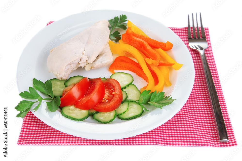 Boiled chicken breast on plate with vegetables close up
