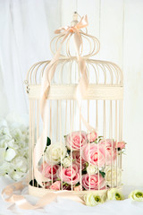 Beautiful decorative cage with beautiful flowers