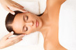 © puhhha - Face Massage. Close-up of a Young Woman Getting Spa Treatment.