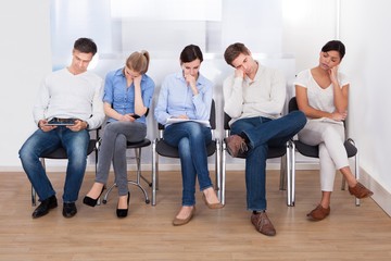 Group Of People Sleeping On Chair