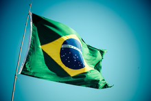 The National Flag Of Brazil (Brasil) Flutters In The Wind