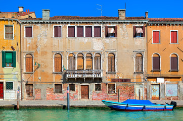 Wall Mural - Old colorful house along narrow canal in Venice.