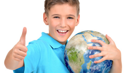 Fototapete - Smiling boy in casual  holding planet earth with thumbs up