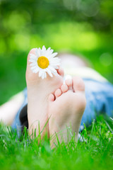 Wall Mural - Kid lying on grass